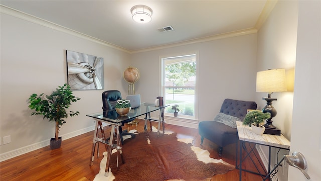 home office featuring wood-type flooring and ornamental molding