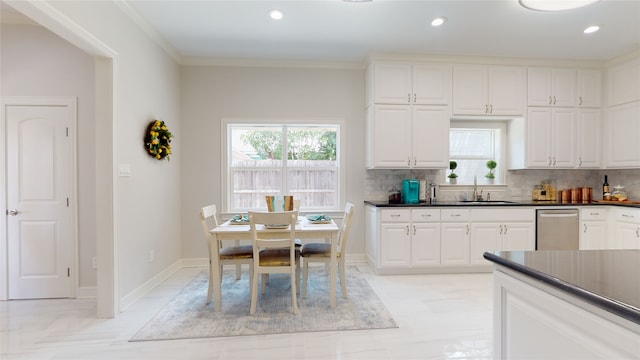 kitchen featuring decorative backsplash, white cabinets, dishwasher, and light tile patterned floors