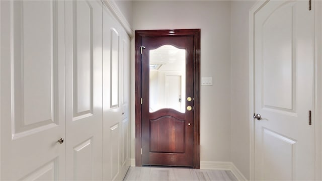 doorway to outside featuring light tile patterned floors