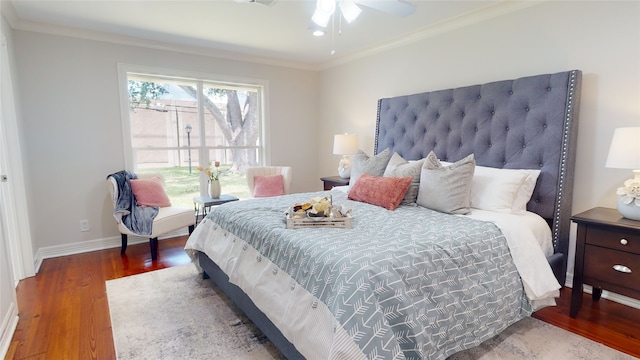 bedroom with ornamental molding, hardwood / wood-style flooring, and ceiling fan