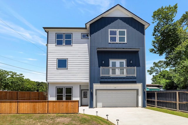 view of front of house featuring a balcony and a garage