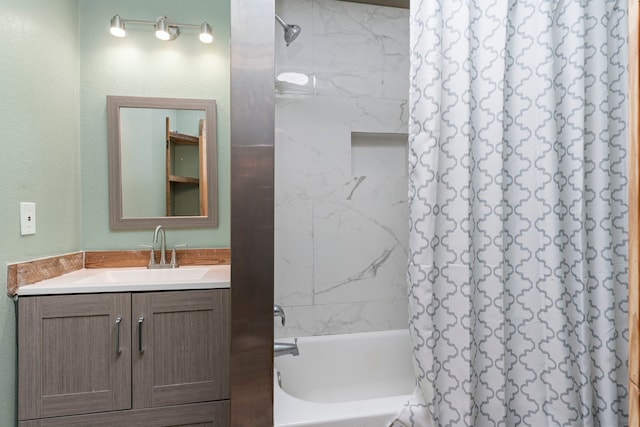 bathroom featuring shower / bath combo and vanity