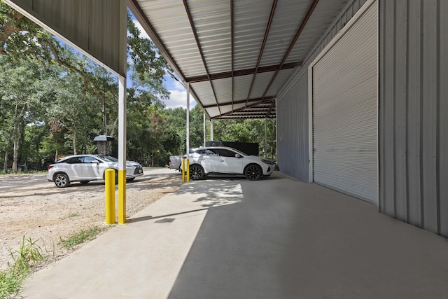 view of vehicle parking with a carport