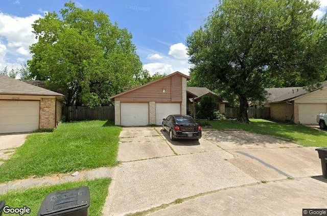 10126 Wild Hollow Ln, Houston, TX 77088 - view of front of property with a detached garage and brick siding