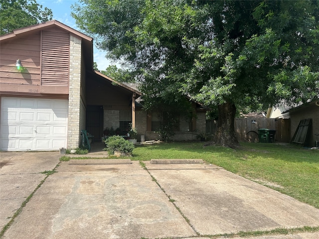 view of front facade featuring a garage and a front lawn