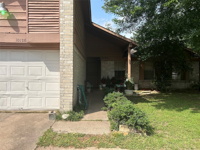 view of home's exterior with a yard and a garage