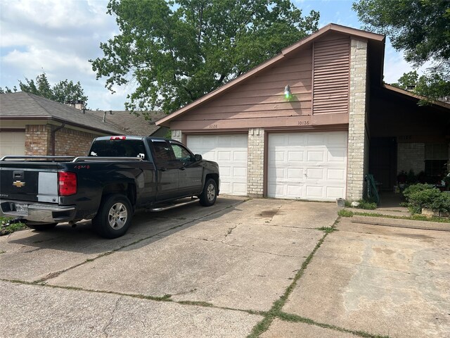 view of side of property featuring a garage