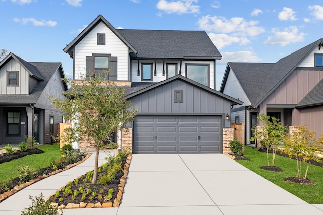 view of front of property featuring a garage and a front lawn