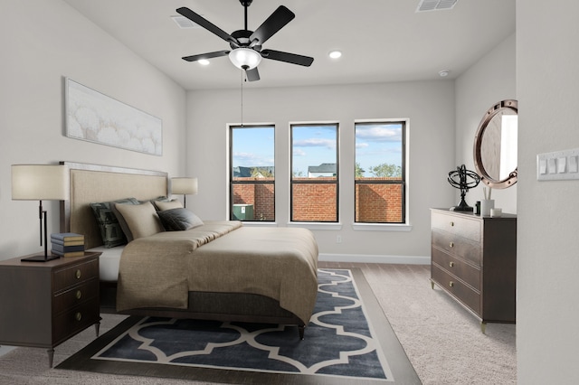 bedroom featuring ceiling fan and light hardwood / wood-style floors