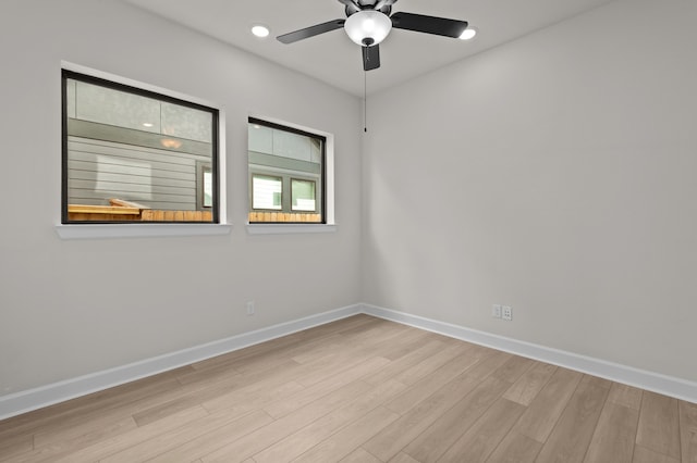 empty room with ceiling fan and light wood-type flooring