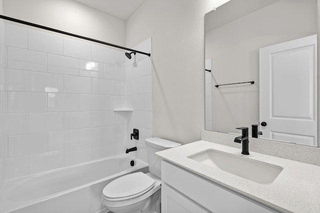 full bathroom with tiled shower / bath combo, toilet, and vanity