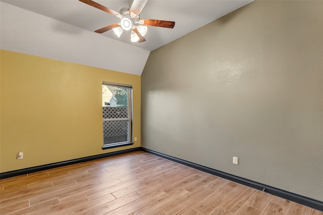 unfurnished room featuring ceiling fan, vaulted ceiling, and light hardwood / wood-style flooring