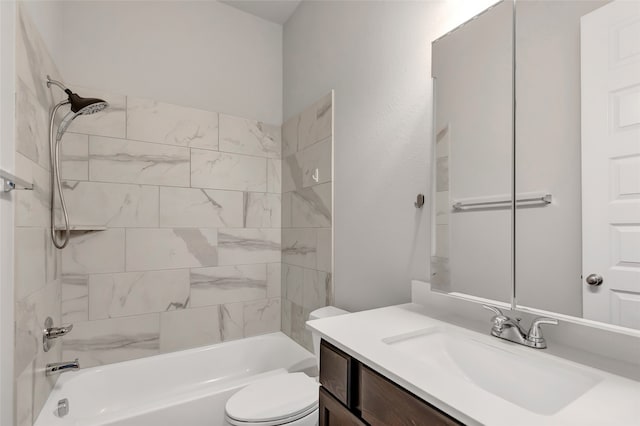 full bathroom featuring toilet, vanity, and tiled shower / bath