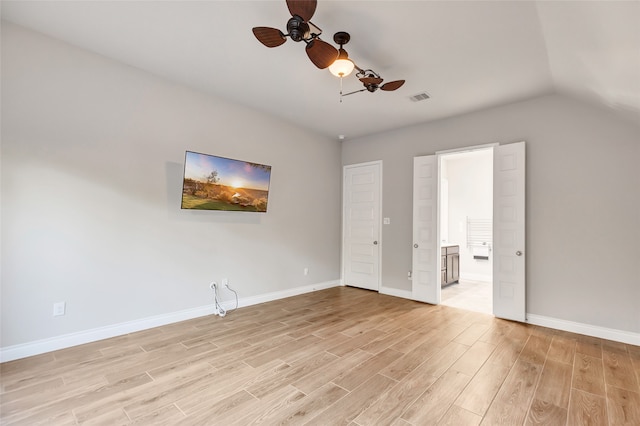 interior space with ceiling fan, light wood-type flooring, and vaulted ceiling