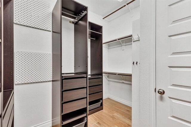 walk in closet featuring light wood-type flooring