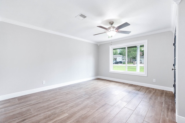 spare room featuring crown molding, ceiling fan, and light hardwood / wood-style floors