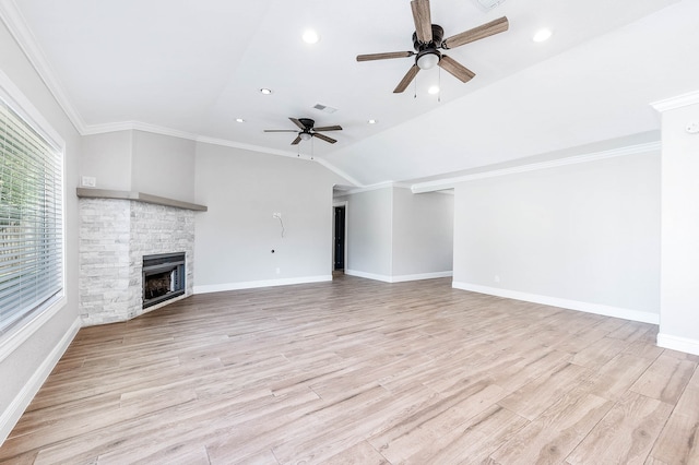 unfurnished living room with a stone fireplace, crown molding, light wood-type flooring, and ceiling fan