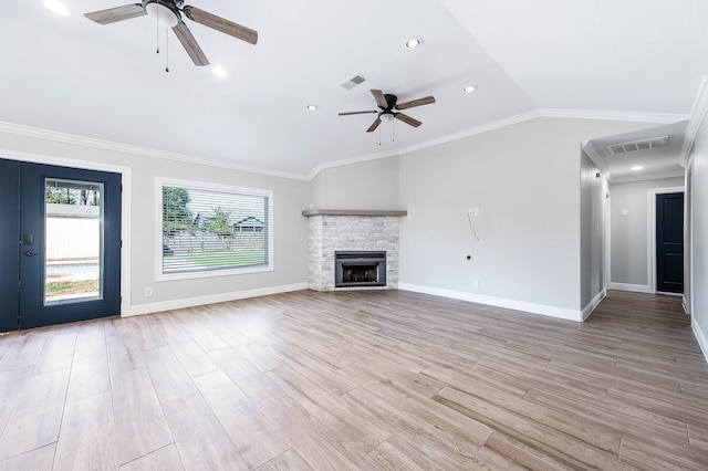 unfurnished living room with lofted ceiling, ornamental molding, and ceiling fan