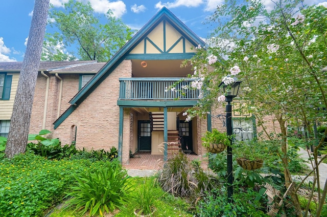 view of front of home with a balcony