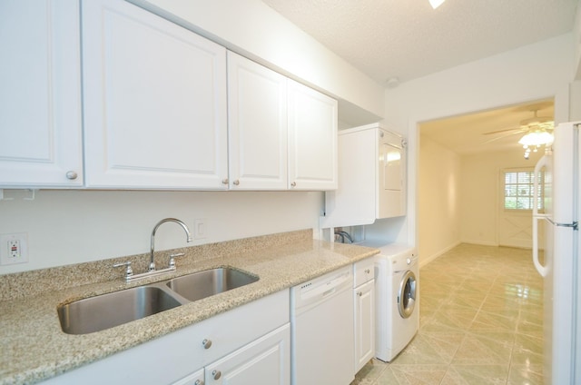 kitchen featuring light stone countertops, white appliances, ceiling fan, sink, and white cabinetry