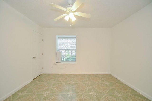 unfurnished room featuring ceiling fan