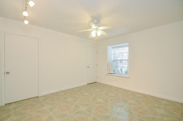 spare room featuring ceiling fan