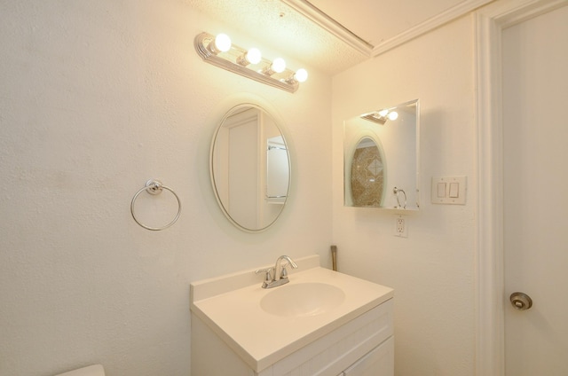 bathroom featuring vanity and a textured ceiling