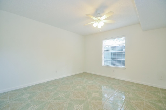 unfurnished room featuring ceiling fan