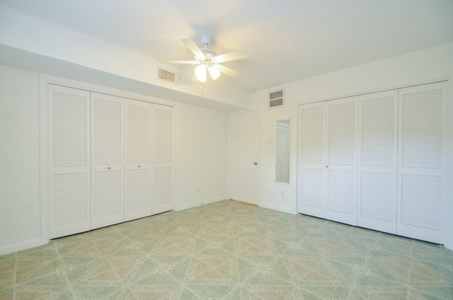 unfurnished bedroom featuring ceiling fan