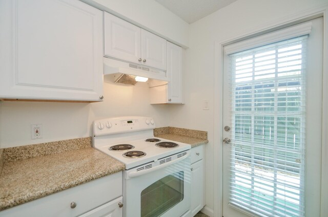 kitchen with white cabinetry and electric stove