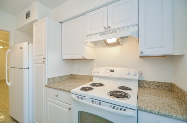 kitchen with white appliances and white cabinetry