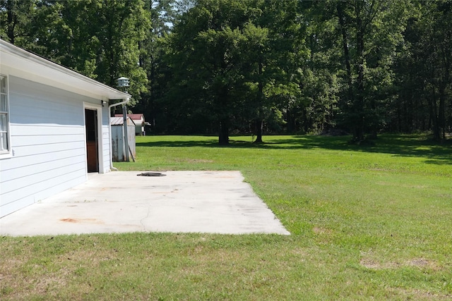 view of yard featuring a patio area and an outdoor fire pit