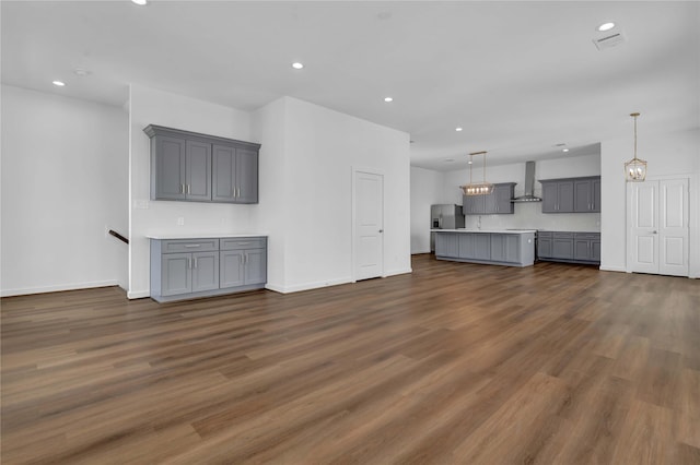 unfurnished living room with dark hardwood / wood-style floors