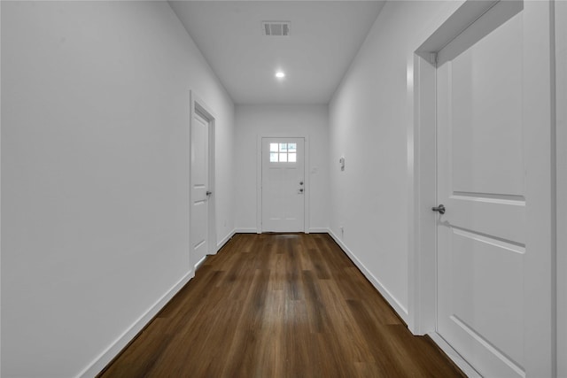 hall with dark hardwood / wood-style floors