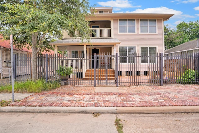 view of front of home featuring a balcony