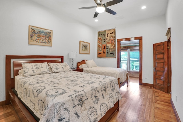 bedroom with ceiling fan and hardwood / wood-style floors