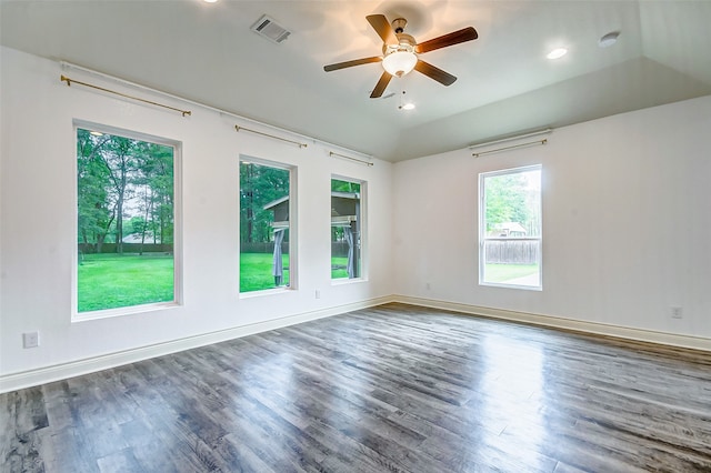 empty room featuring ceiling fan, dark hardwood / wood-style floors, and lofted ceiling