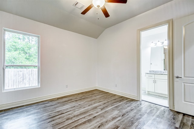 spare room with wood-type flooring and ceiling fan