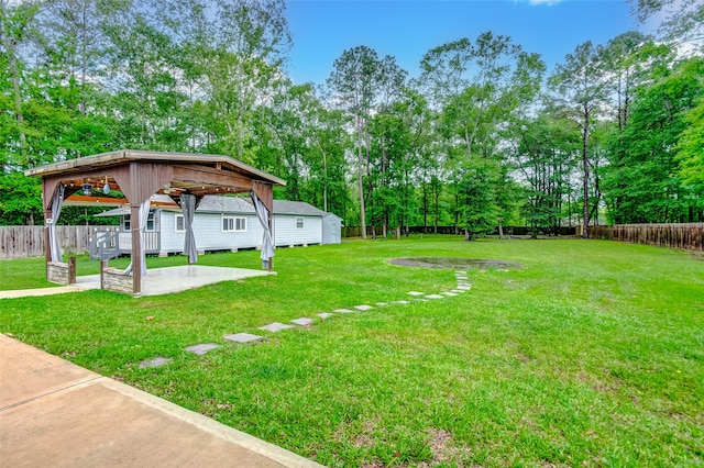 view of yard featuring a patio area and a gazebo