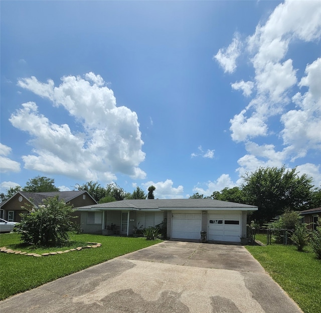 ranch-style home with a front yard and a garage