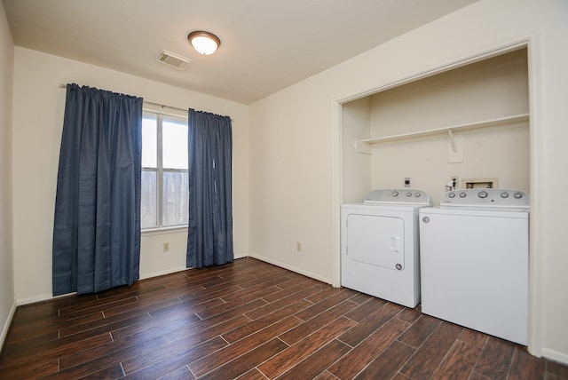 laundry room featuring dark wood-type flooring and independent washer and dryer