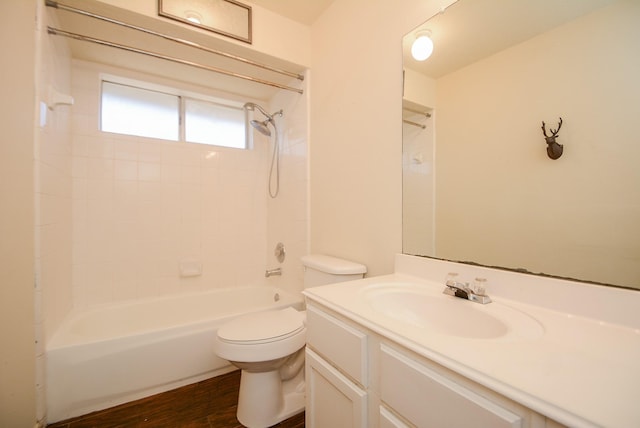 full bath with toilet, vanity, shower / bathing tub combination, and wood finished floors