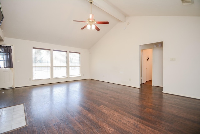 unfurnished room with beam ceiling, wood finished floors, a healthy amount of sunlight, and ceiling fan