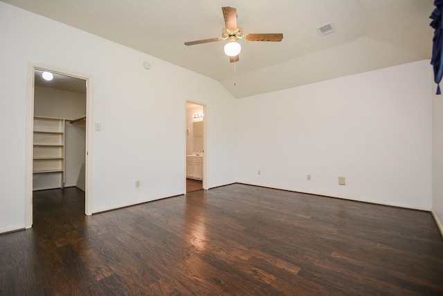 unfurnished room featuring visible vents, a ceiling fan, wood finished floors, baseboards, and lofted ceiling