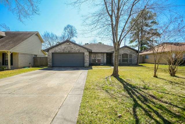 single story home with a front yard and a garage