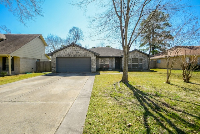 ranch-style house featuring brick siding, an attached garage, concrete driveway, and a front lawn