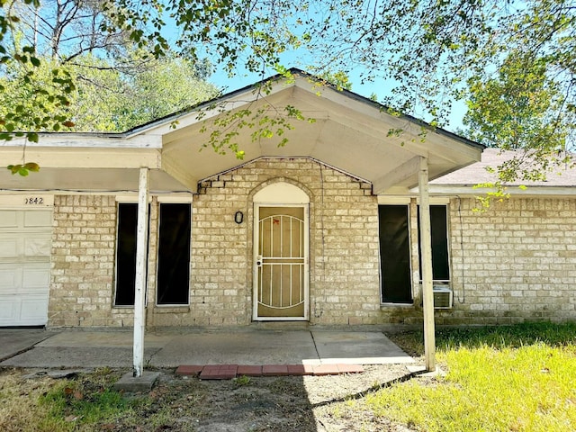 property entrance with a garage