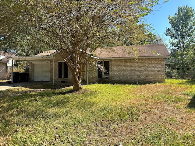 view of front of home with a front lawn, a garage, and a carport