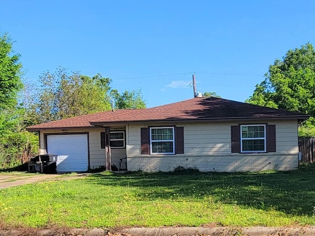 single story home with a front lawn and a garage