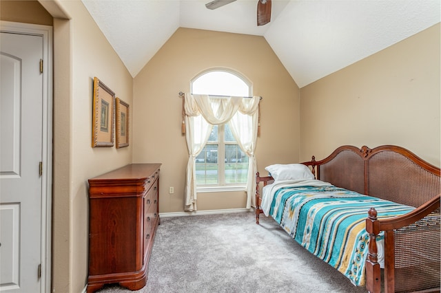 carpeted bedroom featuring ceiling fan and vaulted ceiling